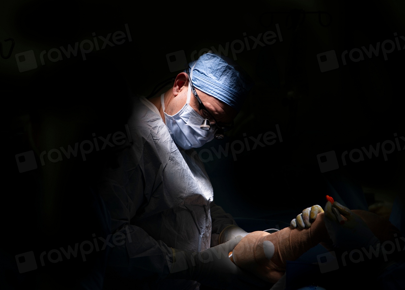 Plastic surgeon prepares a patient